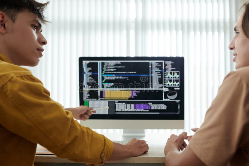 Man Explaining Programming Code To Friend Stock Image Image of study