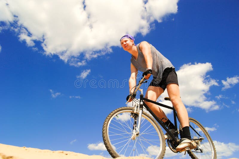 Young men riding a bike