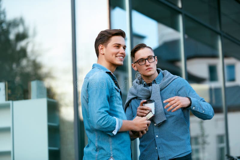 Young Men Talking Near Office Building Stock Photo - Image of college ...