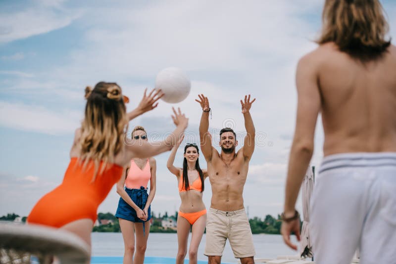 young men and women playing volleyball together royalty free stock photography young men and women playing volleyball together royalty free stock photography