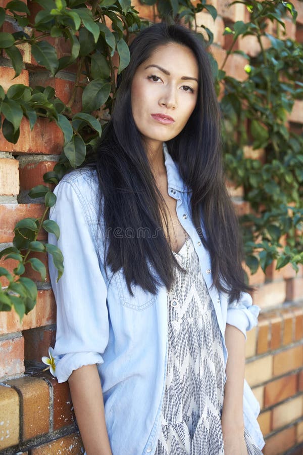 Mixed Race Asian Woman Looking Away, Three Quarter Length Stock Photo