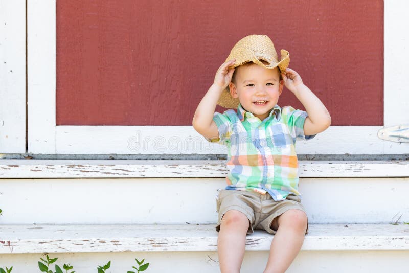 Young Mixed Race Chinese Boy Wearing Cowboy Hat