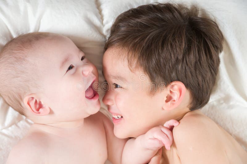 Mixed Race Chinese and Caucasian Baby Brothers Having Fun Laying