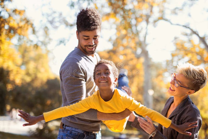 Young mixed race couple spending time with their daughter royalty free stock image Young mixed race couple spending time with their daughter royalty free stock image
