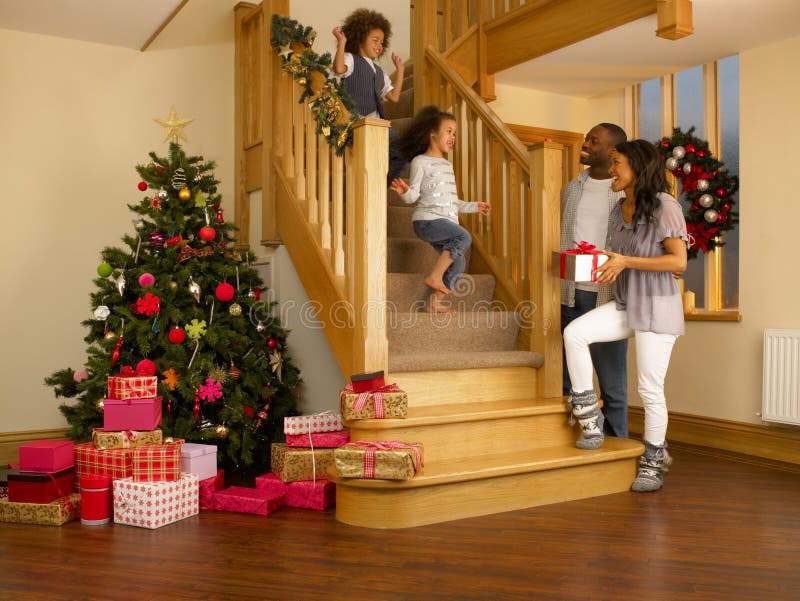 Young mixed race family on Christmas morning stock photography Young mixed race family on Christmas morning stock photography
