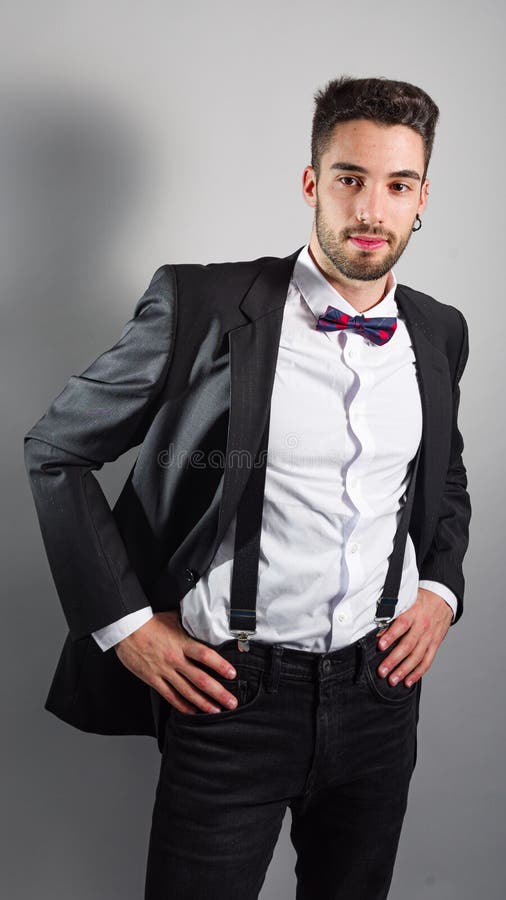 Young Model in a Suit, Bow Tie, Piercings and Fledgling Beard Stock ...