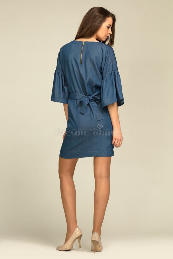 Young model wearing blue, jeans dress with slim body. stock photos Young model wearing blue, jeans dress with slim body. stock photos