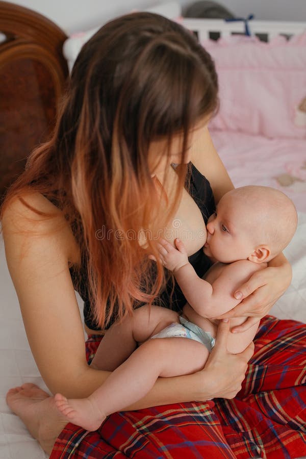 Mother Breast Feeding Teen Daughter