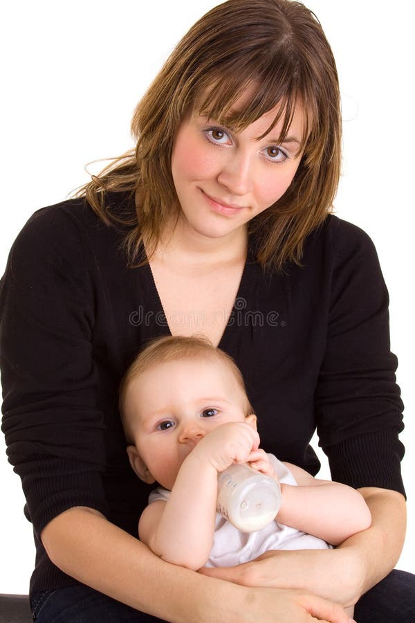 Young mother, baby and milk bottle