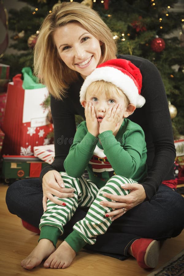 Young Mother and Baby Son Christmas Portrait. 