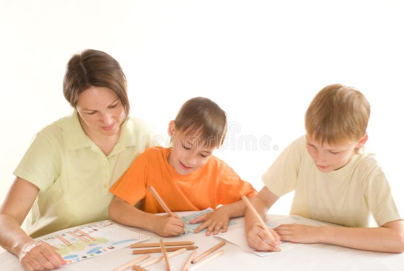 Young mother draws with his sons