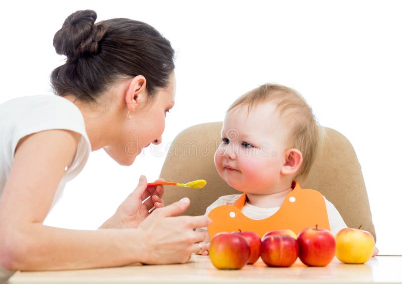 Young mother feeding baby stock images Young mother feeding baby stock images