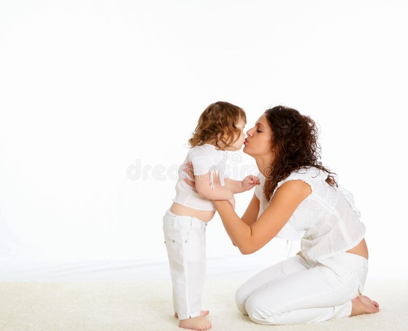 Young mother having fun with her little son