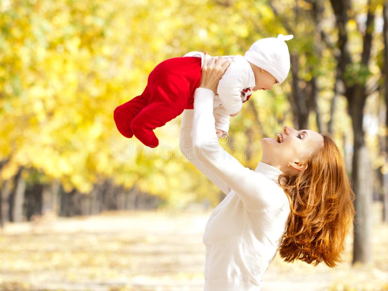 Young mother playing with daughter in autumn park royalty free stock image Young mother playing with daughter in autumn park royalty free stock image