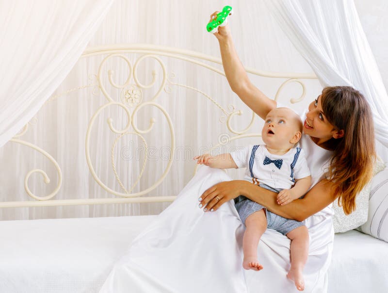 Young mother playing with her little baby royalty free stock photo Young mother playing with her little baby royalty free stock photo