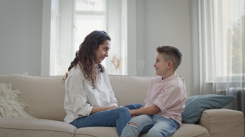 Young Mother and Son on the Couch. Mom Hugs the Boy. they Have Fun Stock Footage - Video of family, barefoot: 207150204