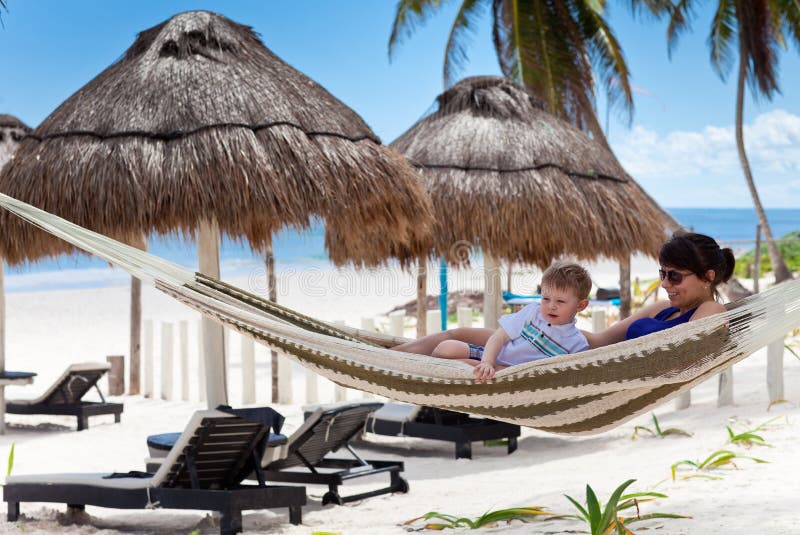 Young mother and son relaxing in a hammock