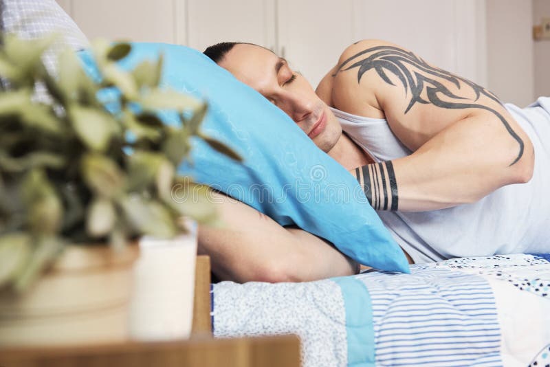 Man Sleeping with Pillow between Legs Stock Photo - Image of