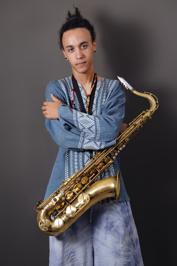 Young musician with saxophone royalty free stock photography Young musician with saxophone royalty free stock photography