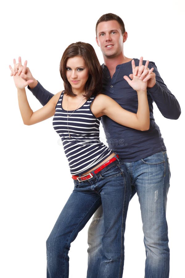 Young nice couple dancing on white background