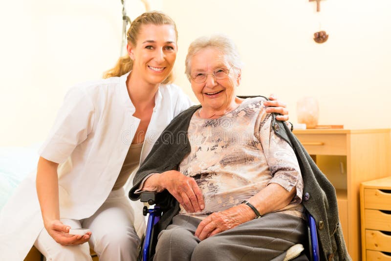 Young nurse and female senior in nursing home, the old lady sitting in a wheel chair