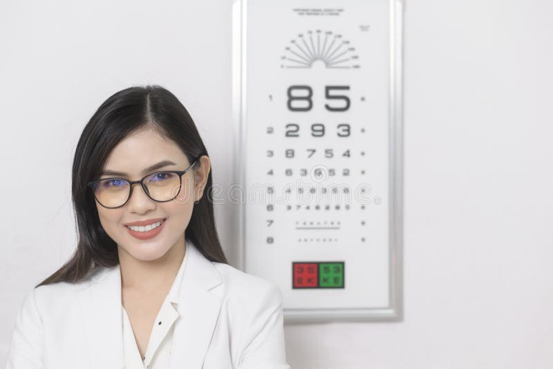 Young Ophthalmologist Doing Visual Test for Customer Using Eye Chart in