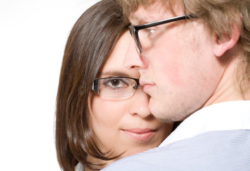 Young pair in glasses, man and woman on white