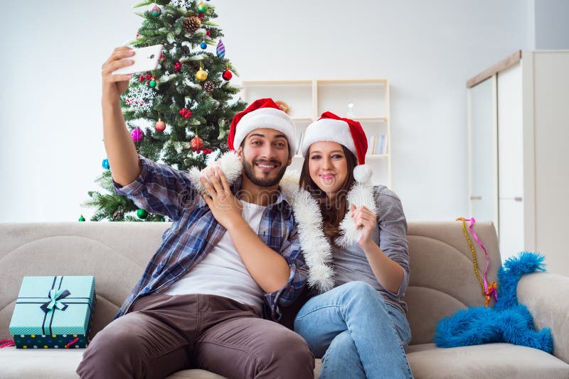 The Young Pair Taking Selfies during Christmas Stock Photo - Image of ...