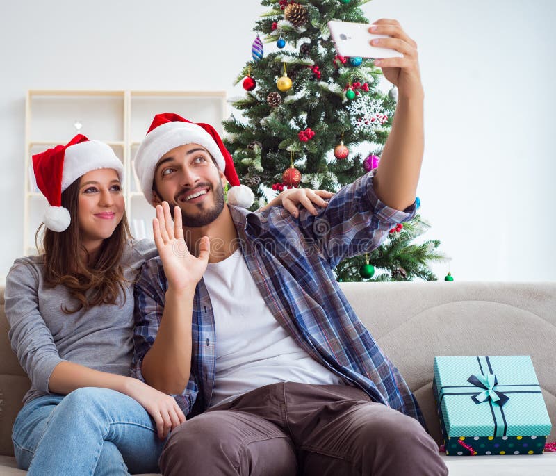 Young Pair Taking Selfies during Christmas Stock Image - Image of home ...