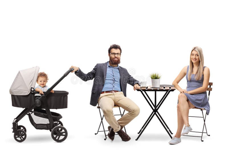 Young parents with a baby in a pushchair sitting at a table