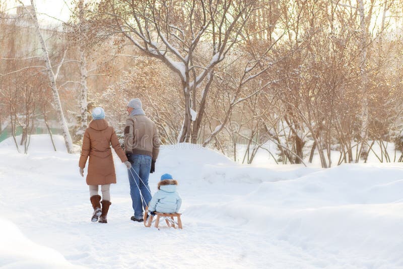 Young parents walking in Winter royalty free stock photography Young parents walking in Winter royalty free stock photography