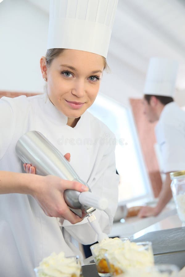 Young pastry cook at work stock photo. Image of cooking 32144912