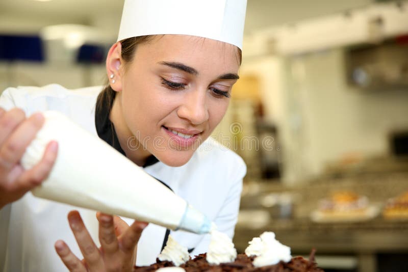 Young pastry cook at work