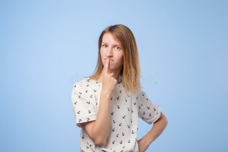 Young pensive caucasian woman over white background stock image Young pensive caucasian woman over white background stock image