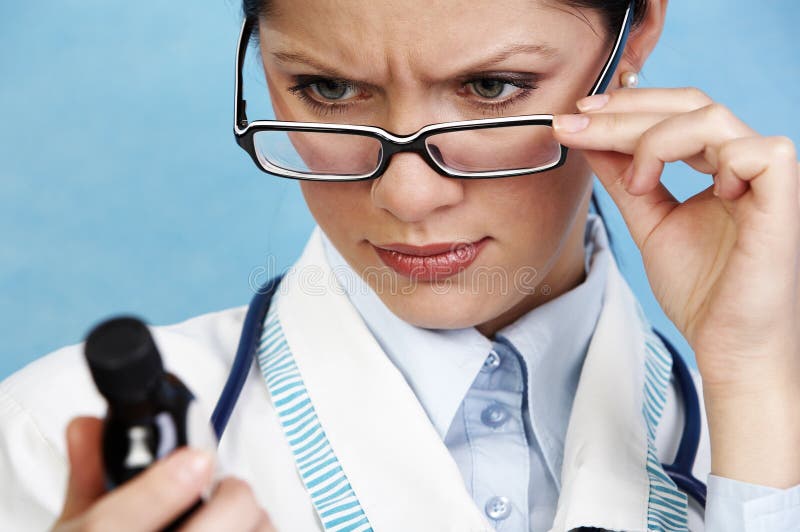 Young pensive female doctor