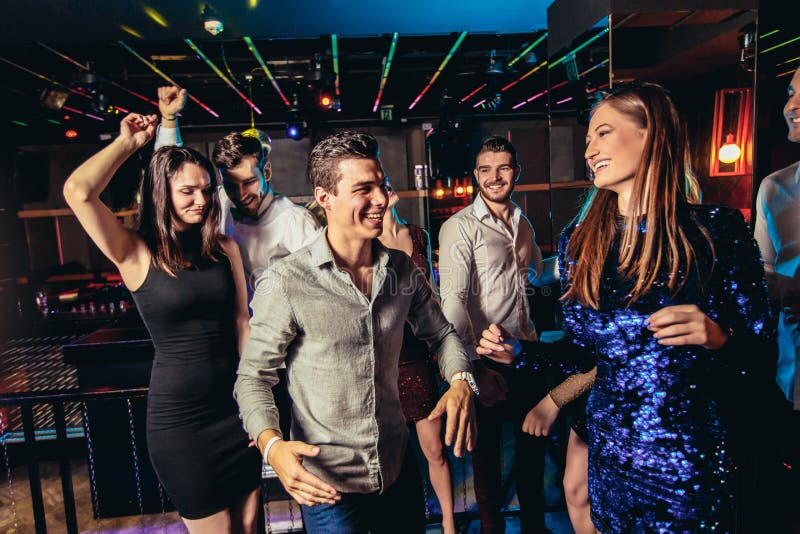 Young People Dancing in Night Club Stock Image - Image of beautiful ...