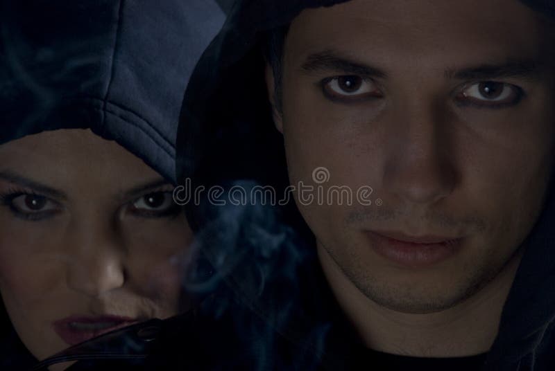 Young people in dark with smoke royalty free stock images
