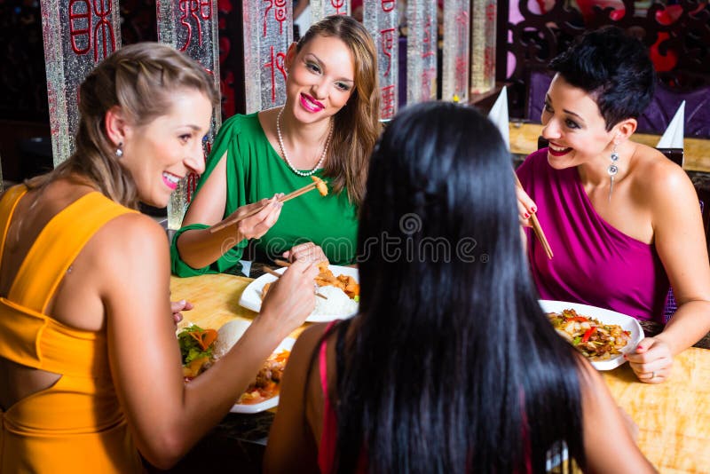 Young people eating in restaurant