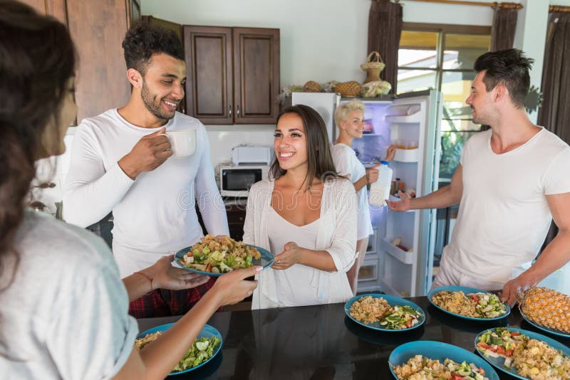 Young People Group Having Breakfast Together, Friends Kitchen Interior Morning Food Drink