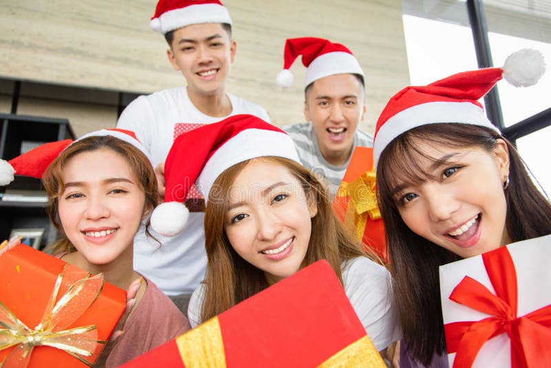 Young people having fun and showing christmas gift royalty free stock images Young people having fun and showing christmas gift royalty free stock images