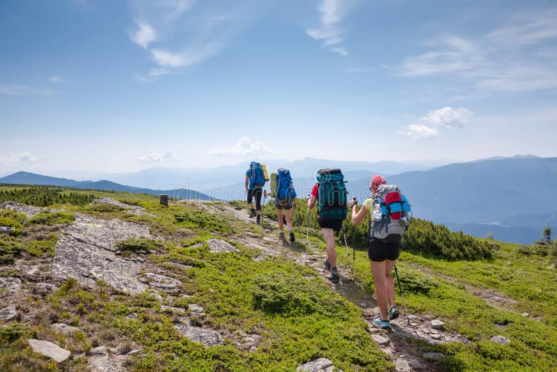 Young people are hiking in Carpathian mountains