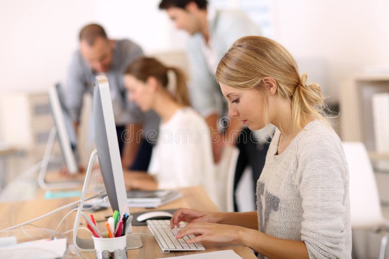 Young people at office working on computers