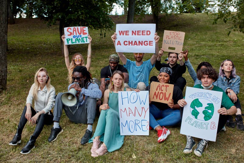 Young diverse people protest with placards and posters on global strike for climate change. save our planet from plastic pollution. World climate change stock images, royalty-free photos and pictures