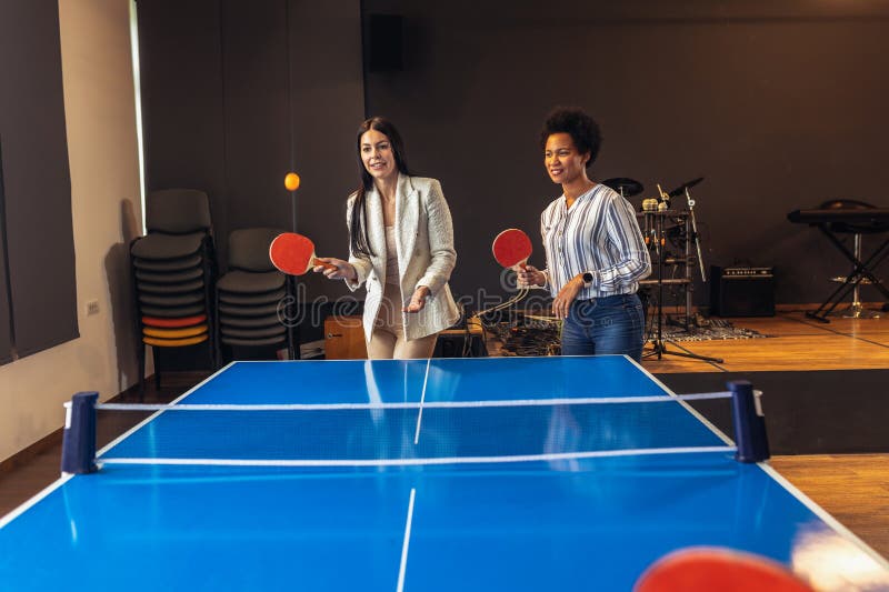 Friends Playing Table Tennis in the Office at Work Stock Image Image