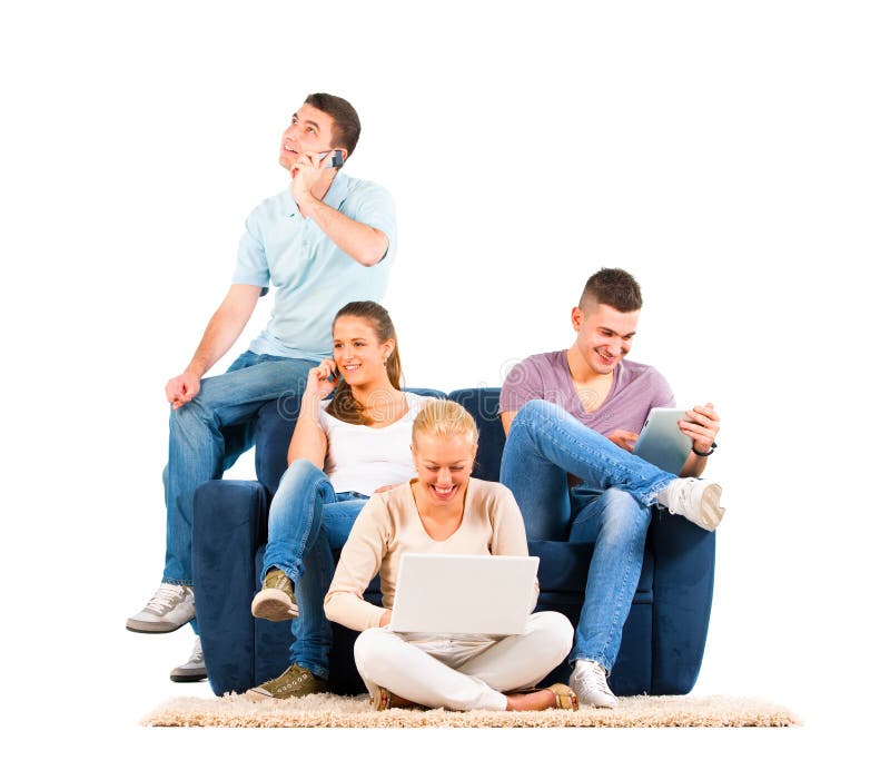 Young people sitting on the sofa with their gadgets on white background