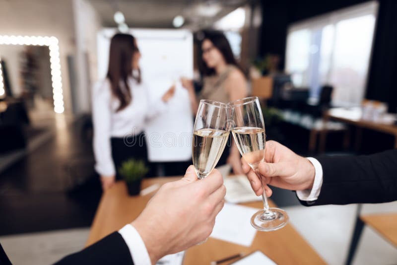 Young people in suits wear alcoholic drinks after a business meeting. stock images Young people in suits wear alcoholic drinks after a business meeting. stock images