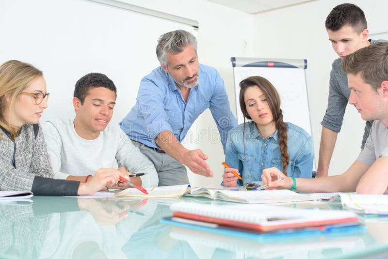 Young people teacher discuss communicate university classroom royalty free stock photos Young people teacher discuss communicate university classroom royalty free stock photos