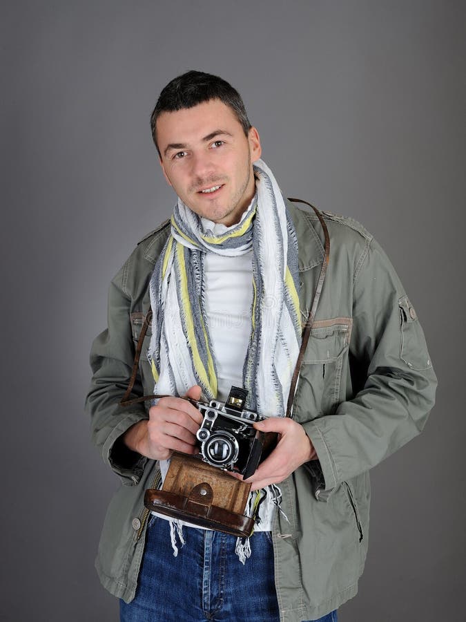 Young photographer with retro film camera