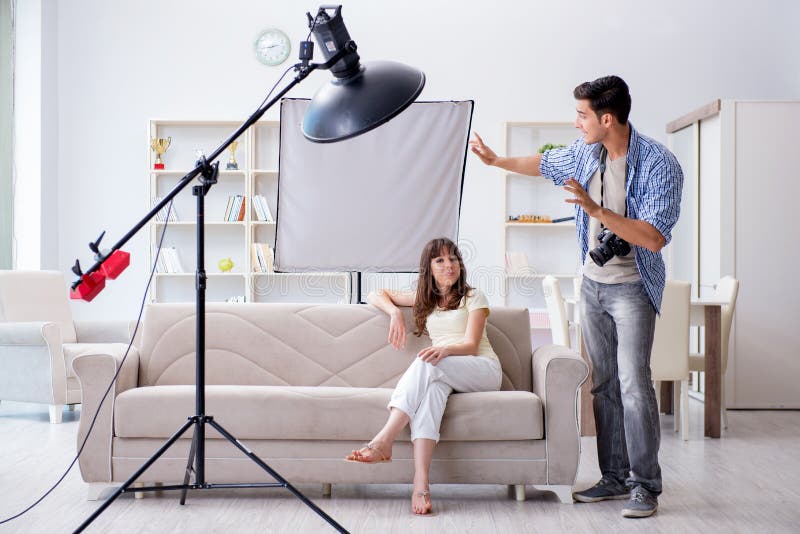 The Young Photographer Working in Photo Studio Stock Photo Image of