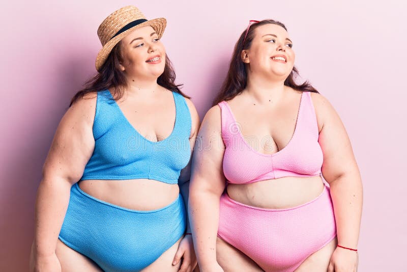 Young Plus Size Twins Wearing Bikini Looking Away To Smile on Face, Natural Expression Stock Photo - Image of teeth, perfect: 219546528